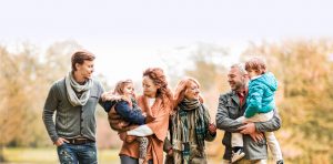 Extended family walking in the park.